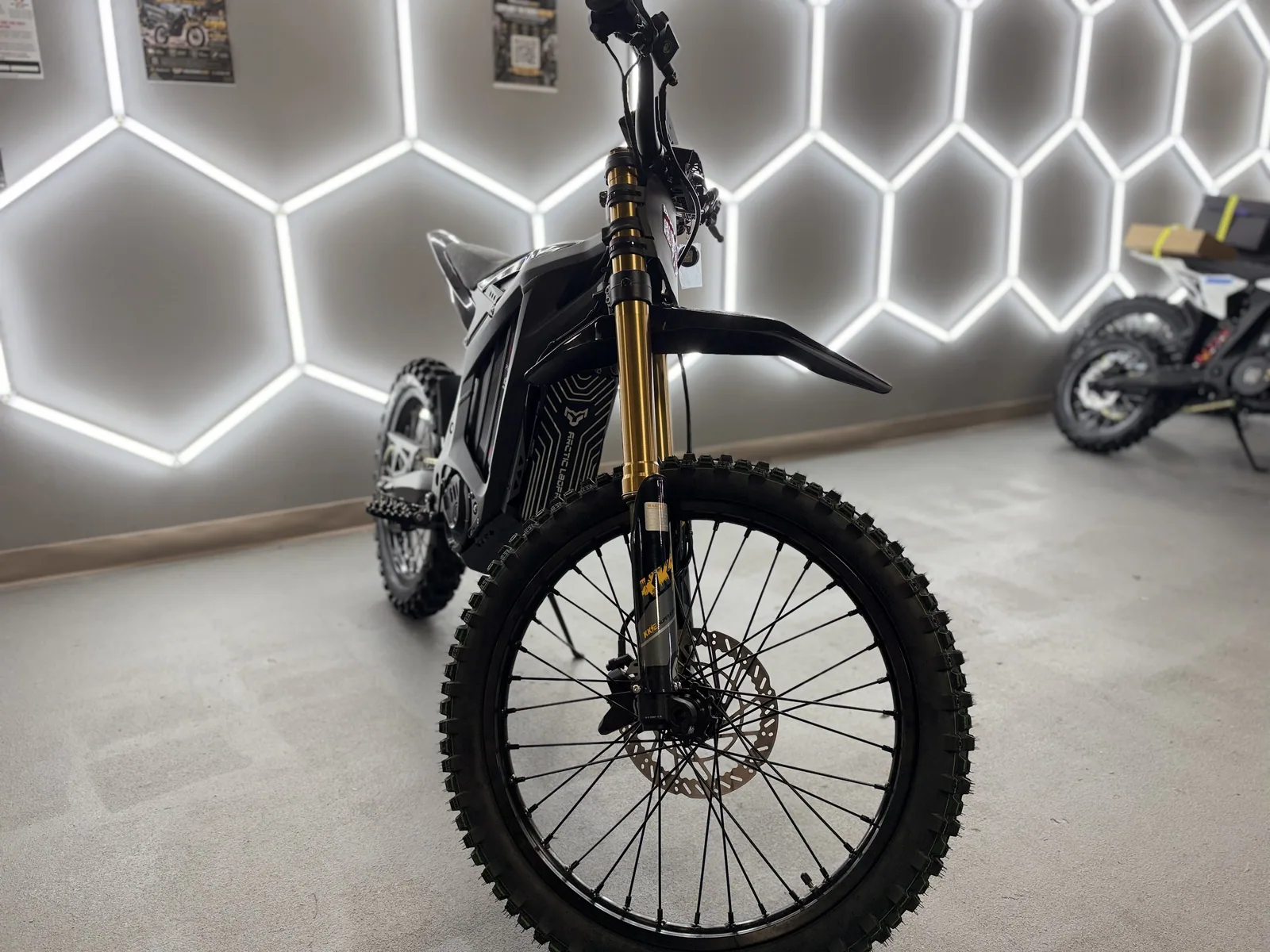 Arctic Leopard XE Pro S Enduro electric dirt bike alternate front three-quarter view at VoltRush USA