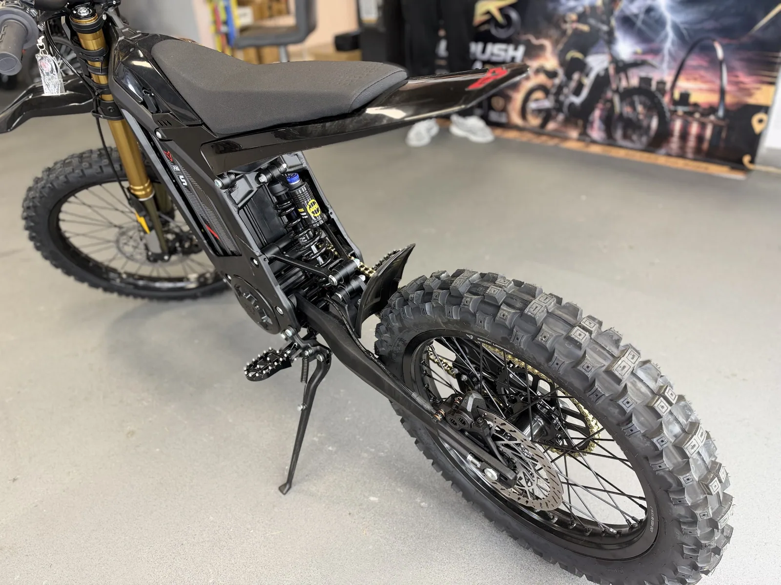 Arctic Leopard XE Pro S Enduro electric dirt bike rear three-quarter view at VoltRush USA