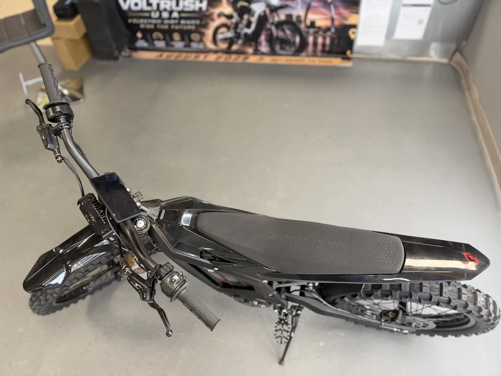 Arctic Leopard XE Pro S Enduro electric dirt bike overhead seat and cockpit view at VoltRush USA