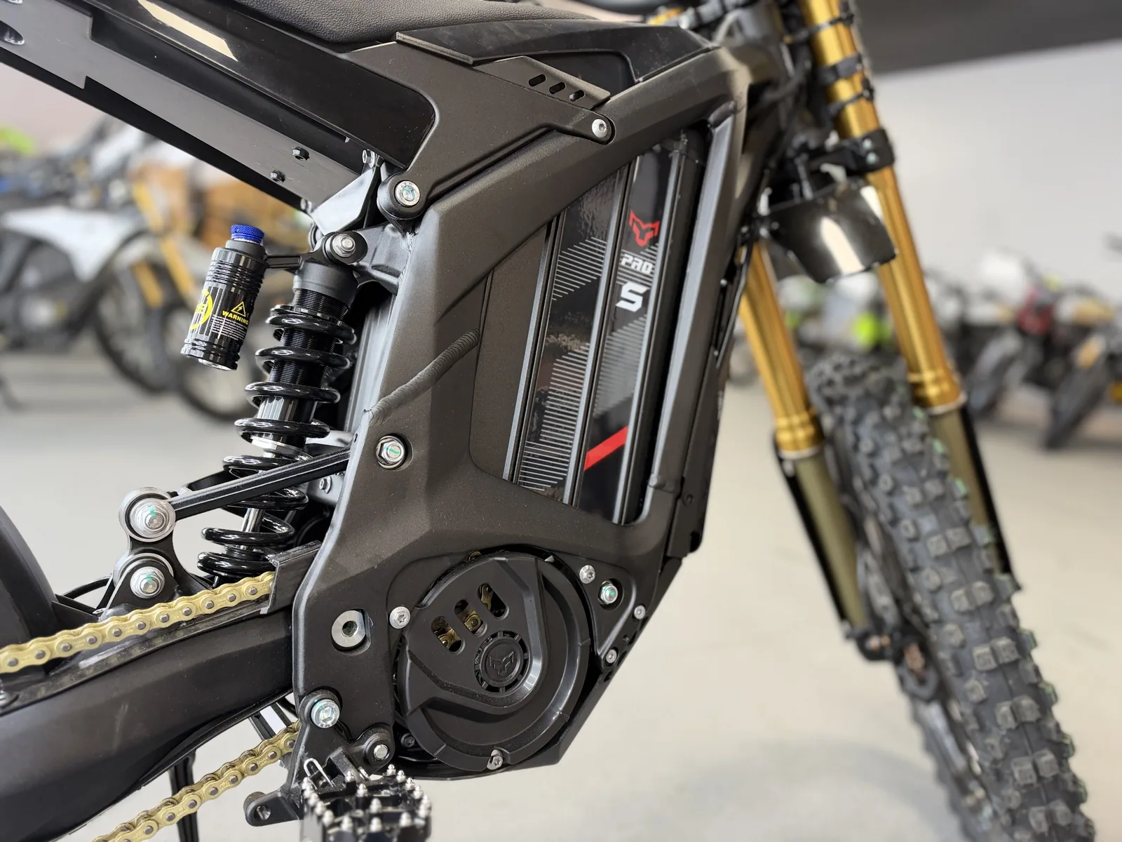 Arctic Leopard XE Pro S Enduro electric dirt bike frame and rear shock detail