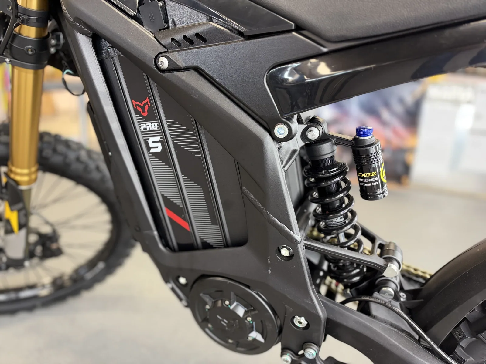 Arctic Leopard XE Pro S Enduro electric dirt bike battery side panel detail