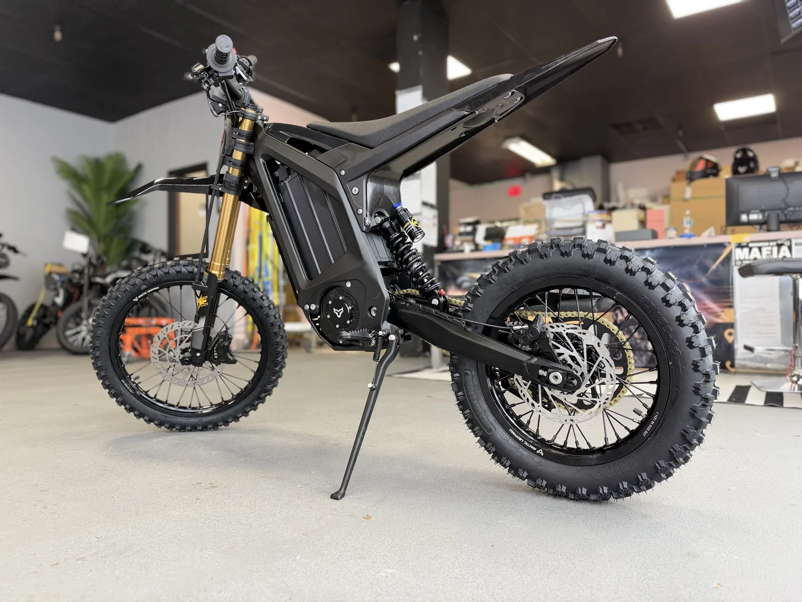 Arctic Leopard XF electric dirt bike rear three-quarter view at VoltRush USA