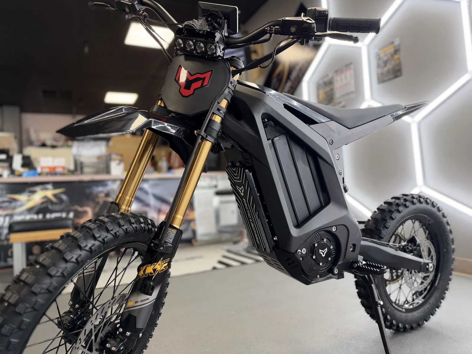 Arctic Leopard XF electric dirt bike alternate front three-quarter view at VoltRush USA