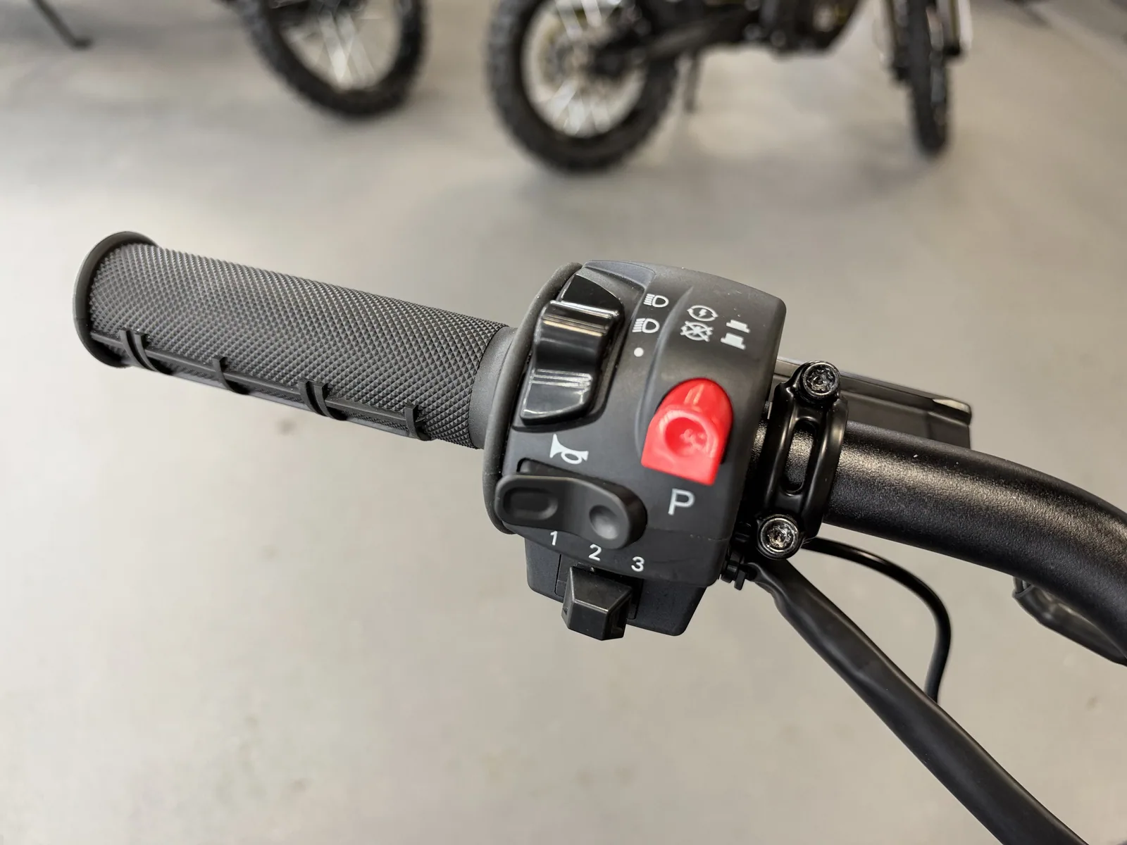 Arctic Leopard XF electric dirt bike right handlebar controls detail