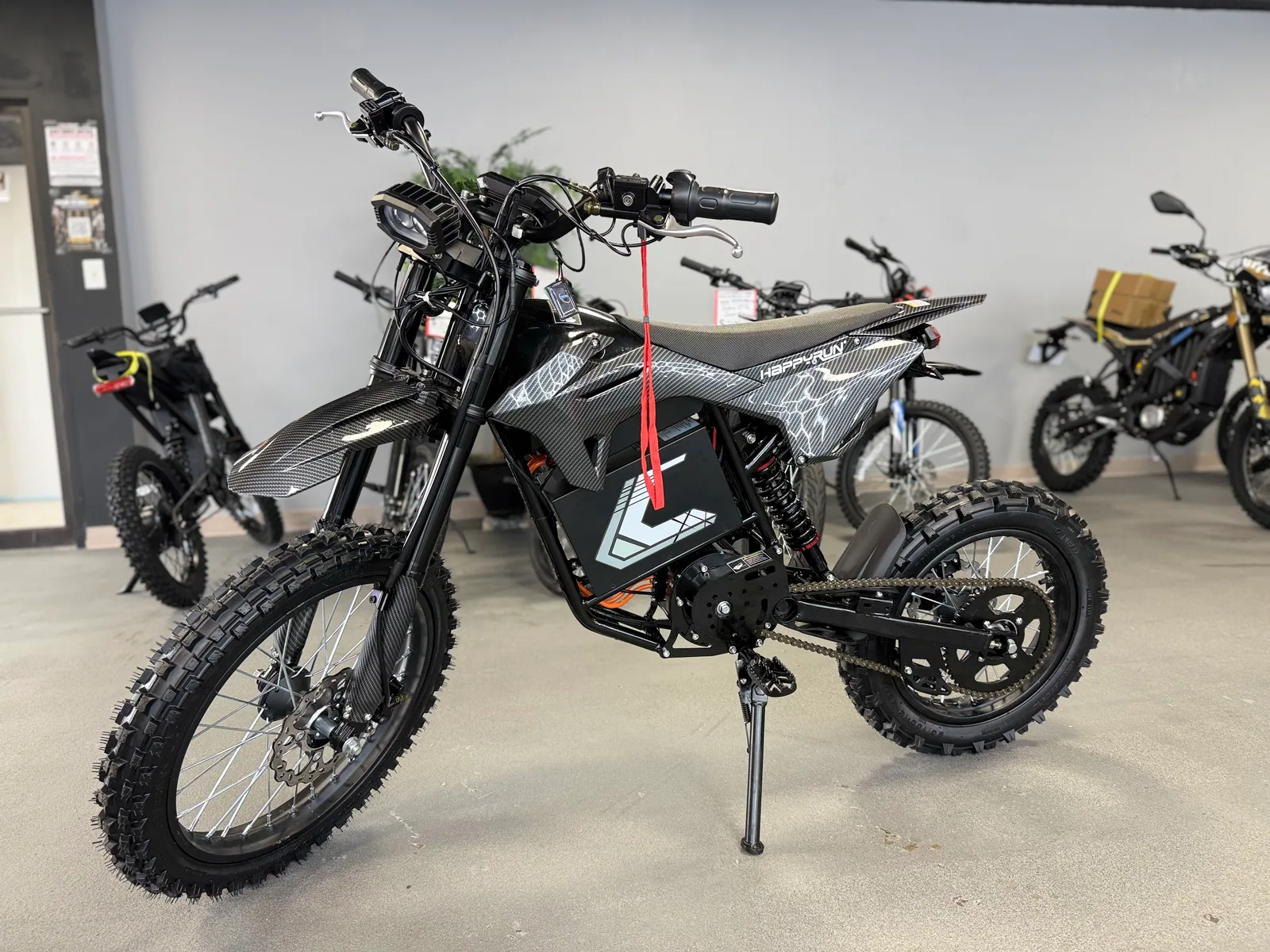 HappyRun F18 2.0 electric dirt bike front three-quarter view at VoltRush USA