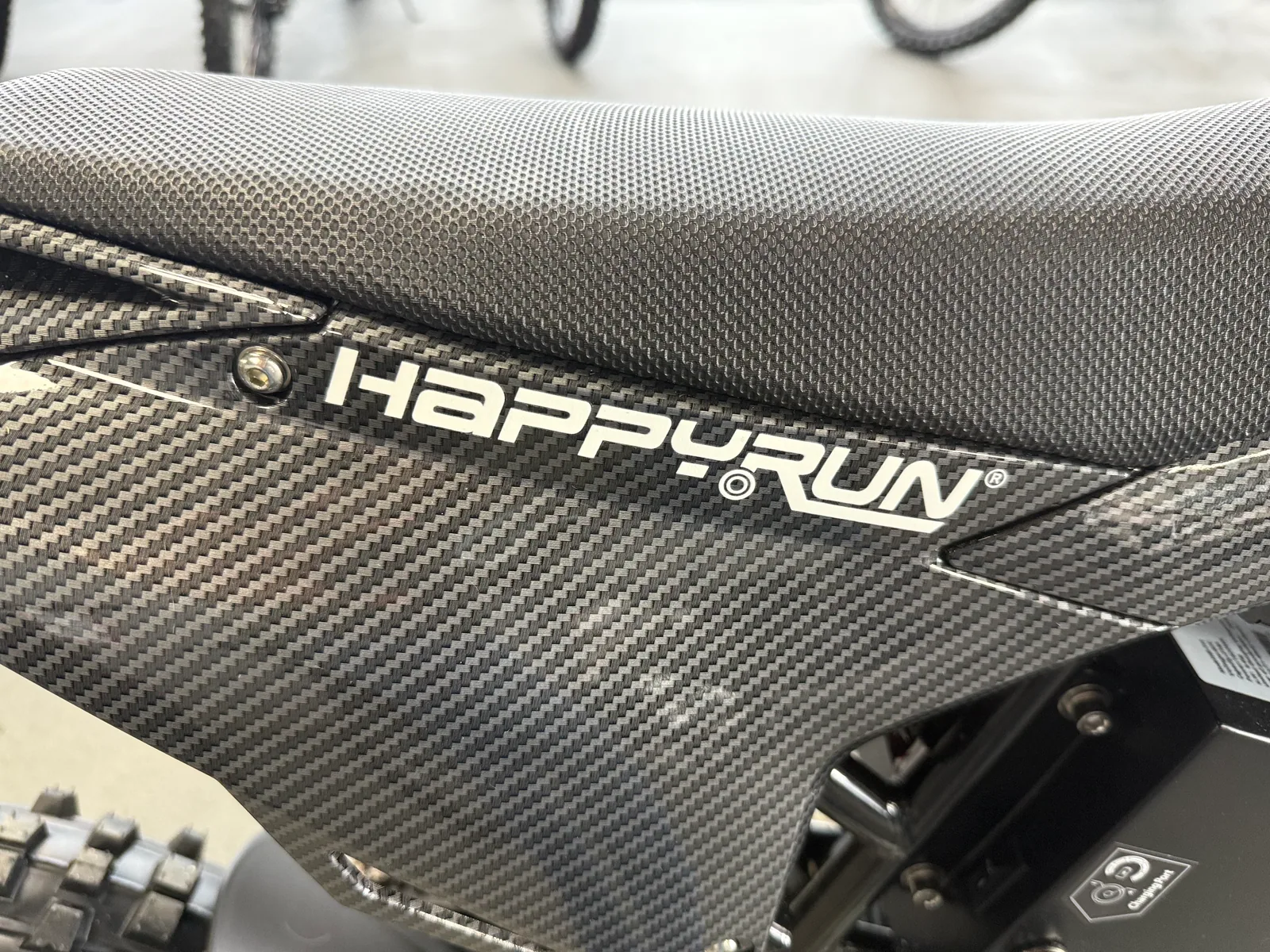 HappyRun F18 2.0 electric dirt bike rear wheel and drivetrain detail