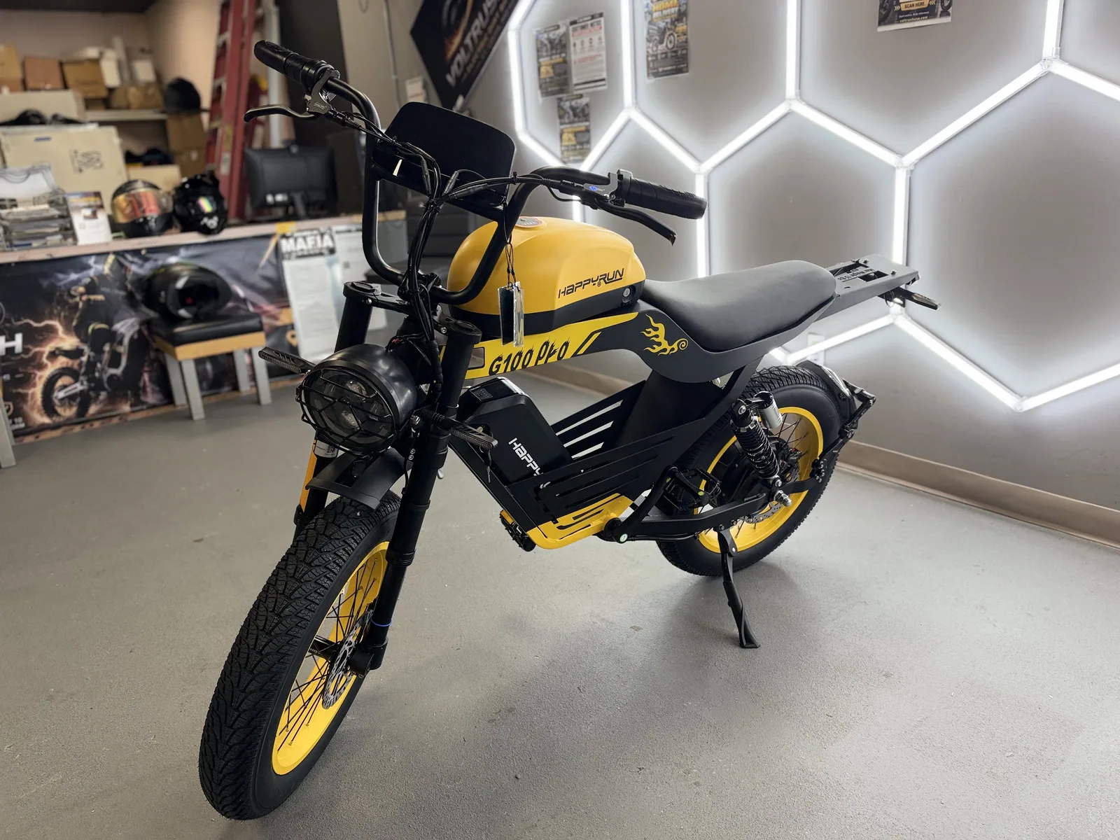 Yellow HappyRun G100 Pro electric dirt bike front three-quarter view at VoltRush USA