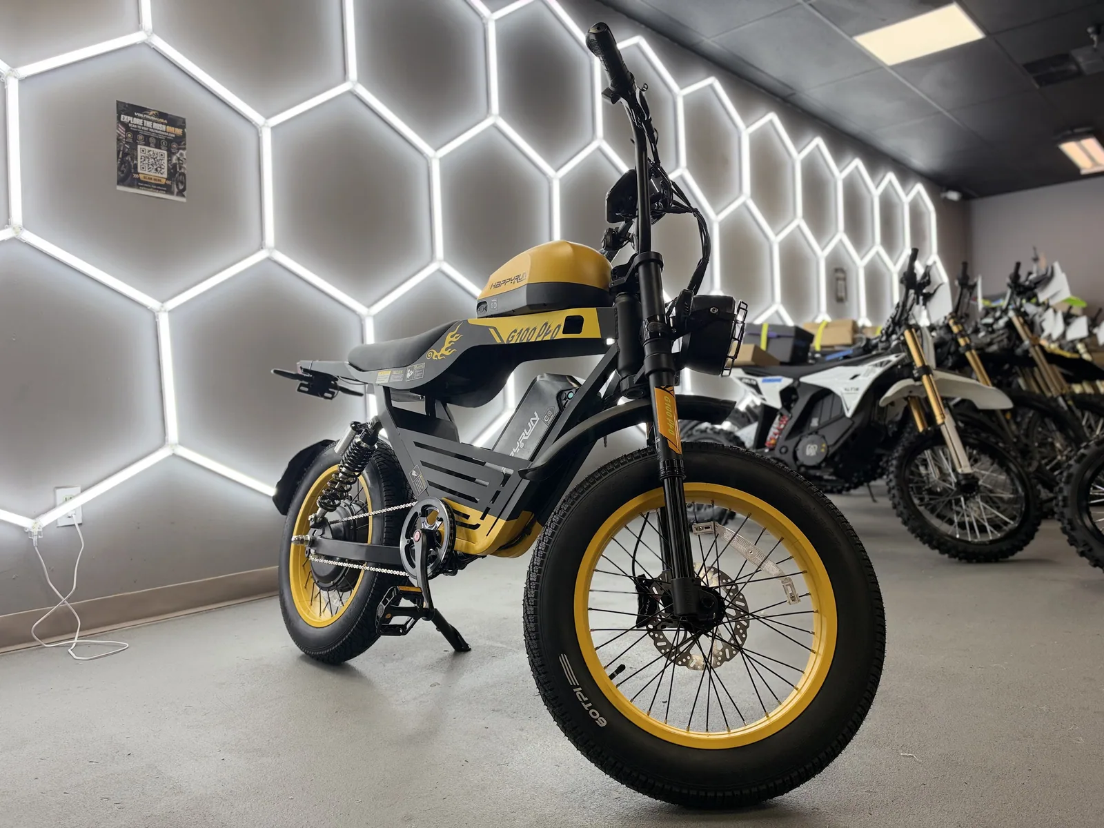 Yellow HappyRun G100 Pro electric dirt bike front quarter view at VoltRush USA
