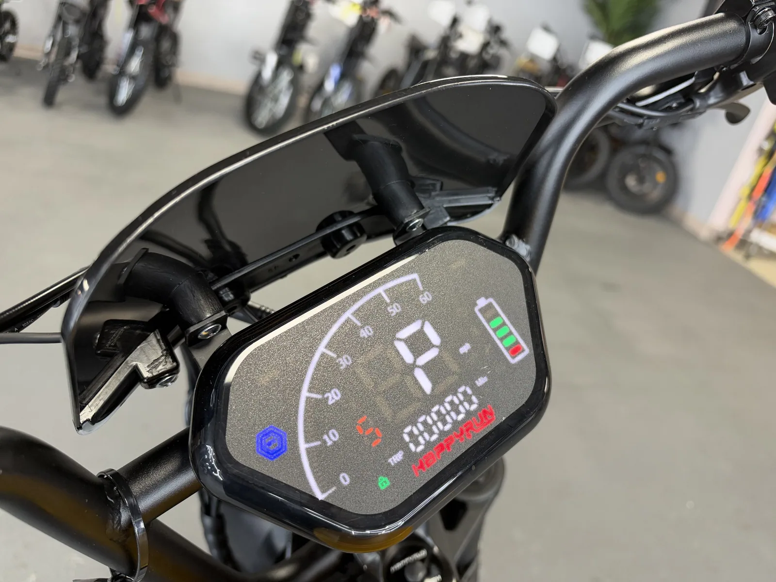 Yellow HappyRun G100 Pro electric dirt bike display detail