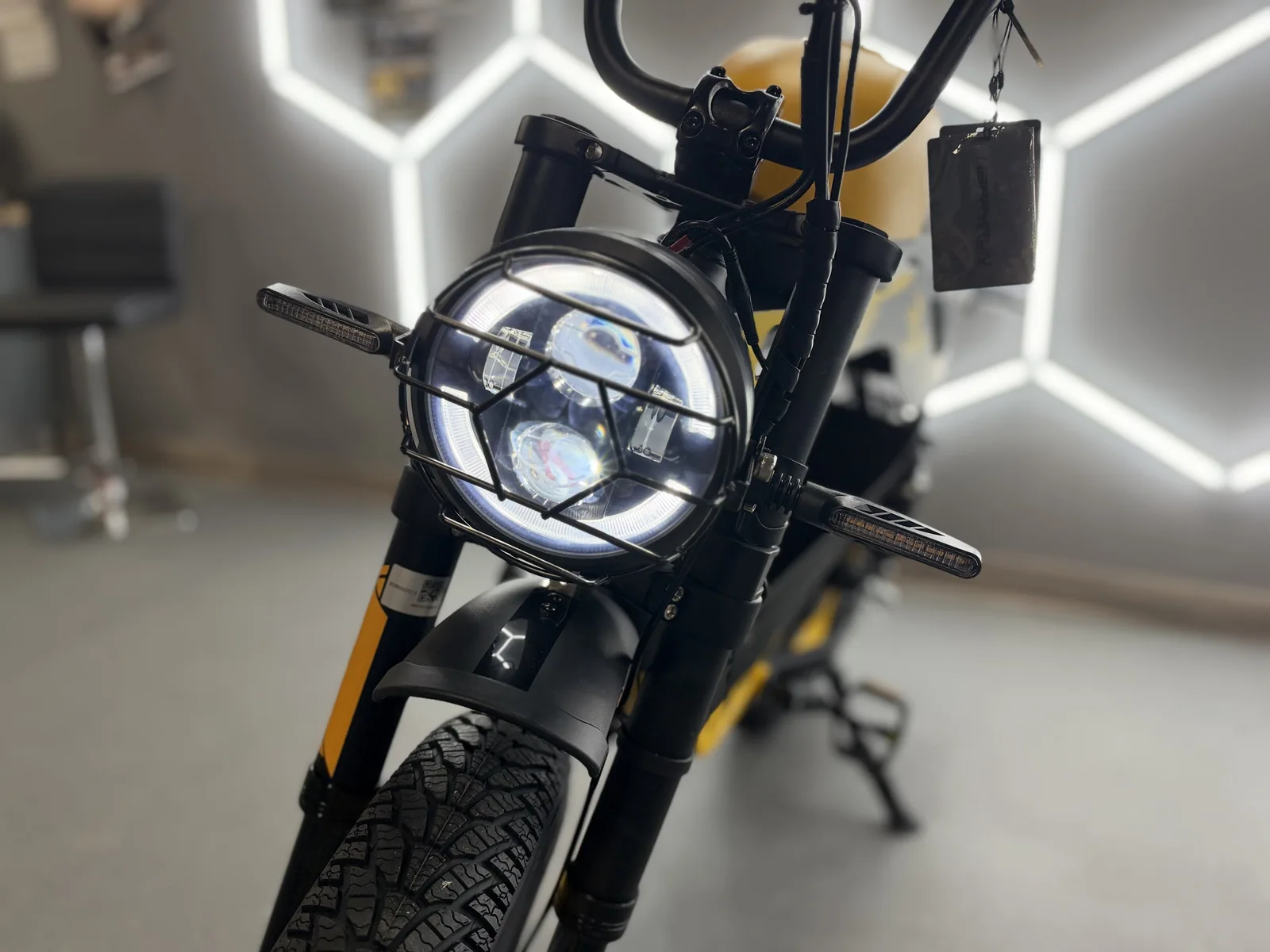 Yellow HappyRun G100 Pro electric dirt bike headlight detail