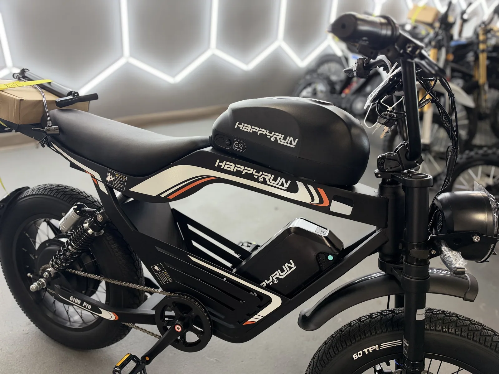 Black HappyRun G100 Pro electric dirt bike front three-quarter view at VoltRush USA