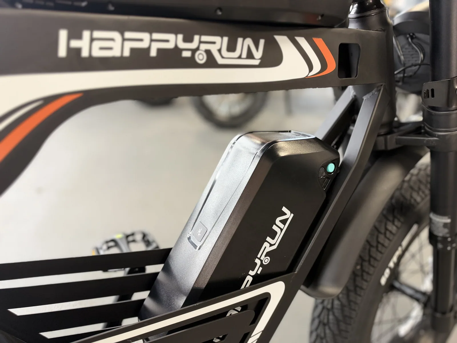Black HappyRun G100 Pro electric dirt bike battery and frame detail