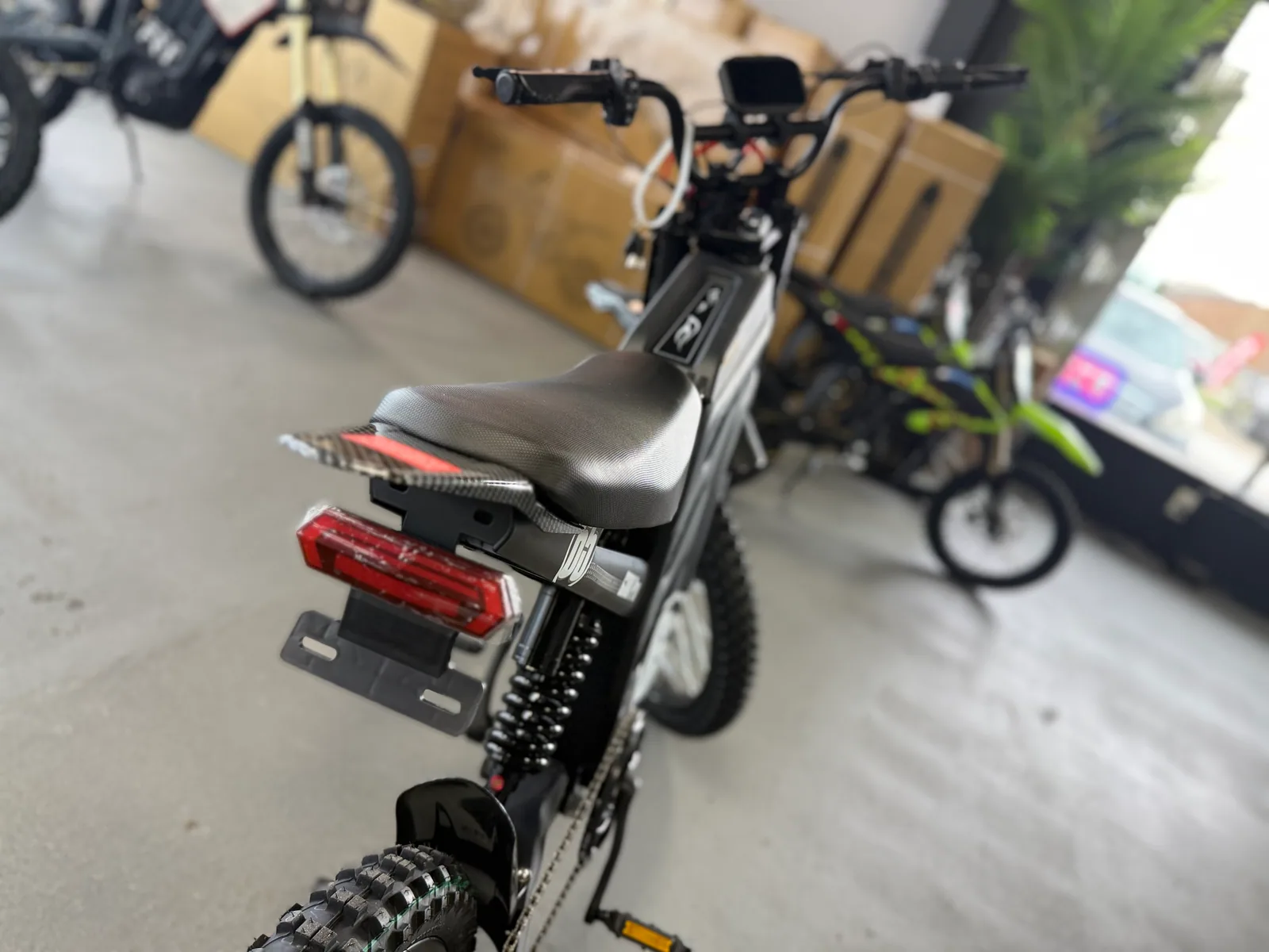 Black HappyRun G300 Pro electric dirt bike rear wheel and brake detail