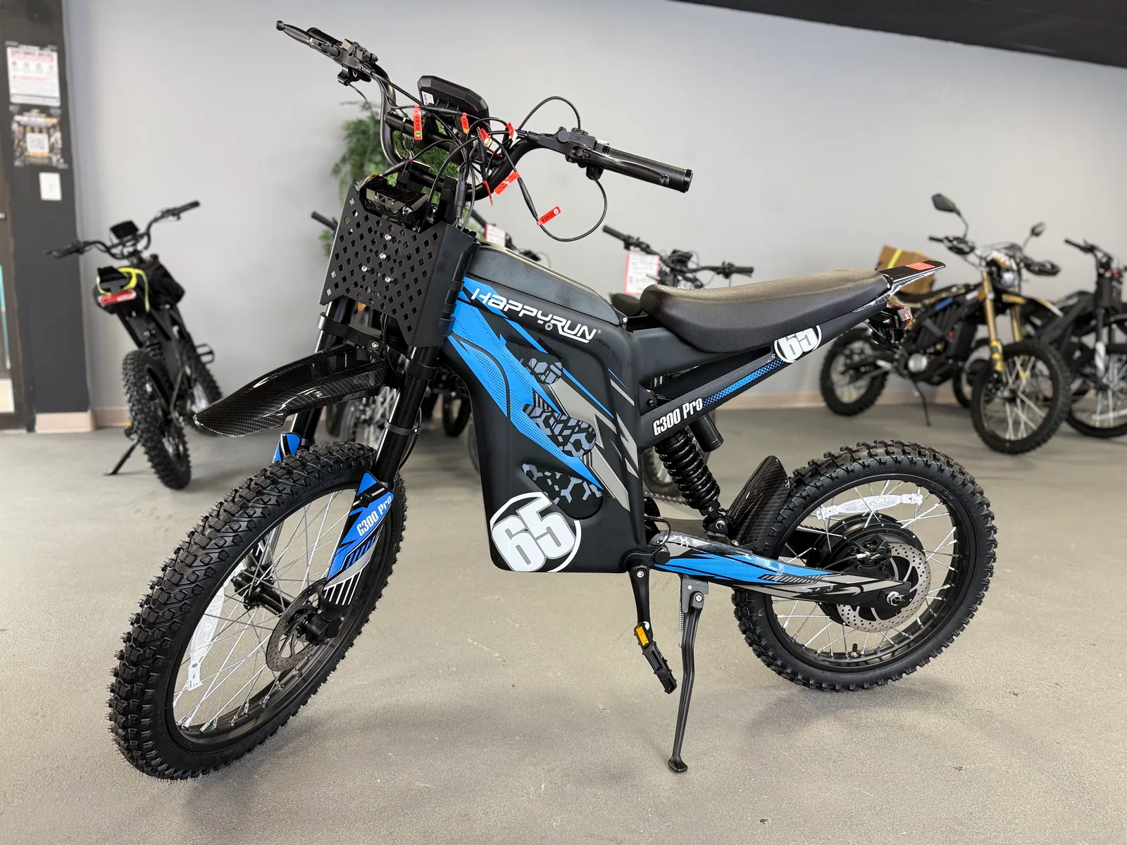 Blue HappyRun G300 Pro electric dirt bike front three-quarter view at VoltRush USA