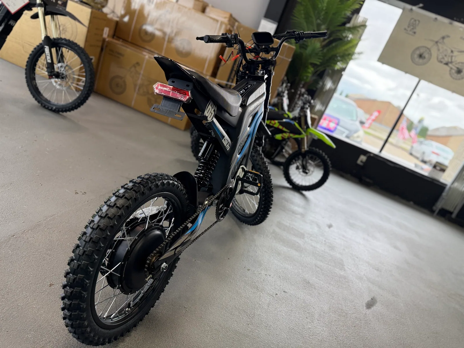 Blue HappyRun G300 Pro electric dirt bike battery and frame detail
