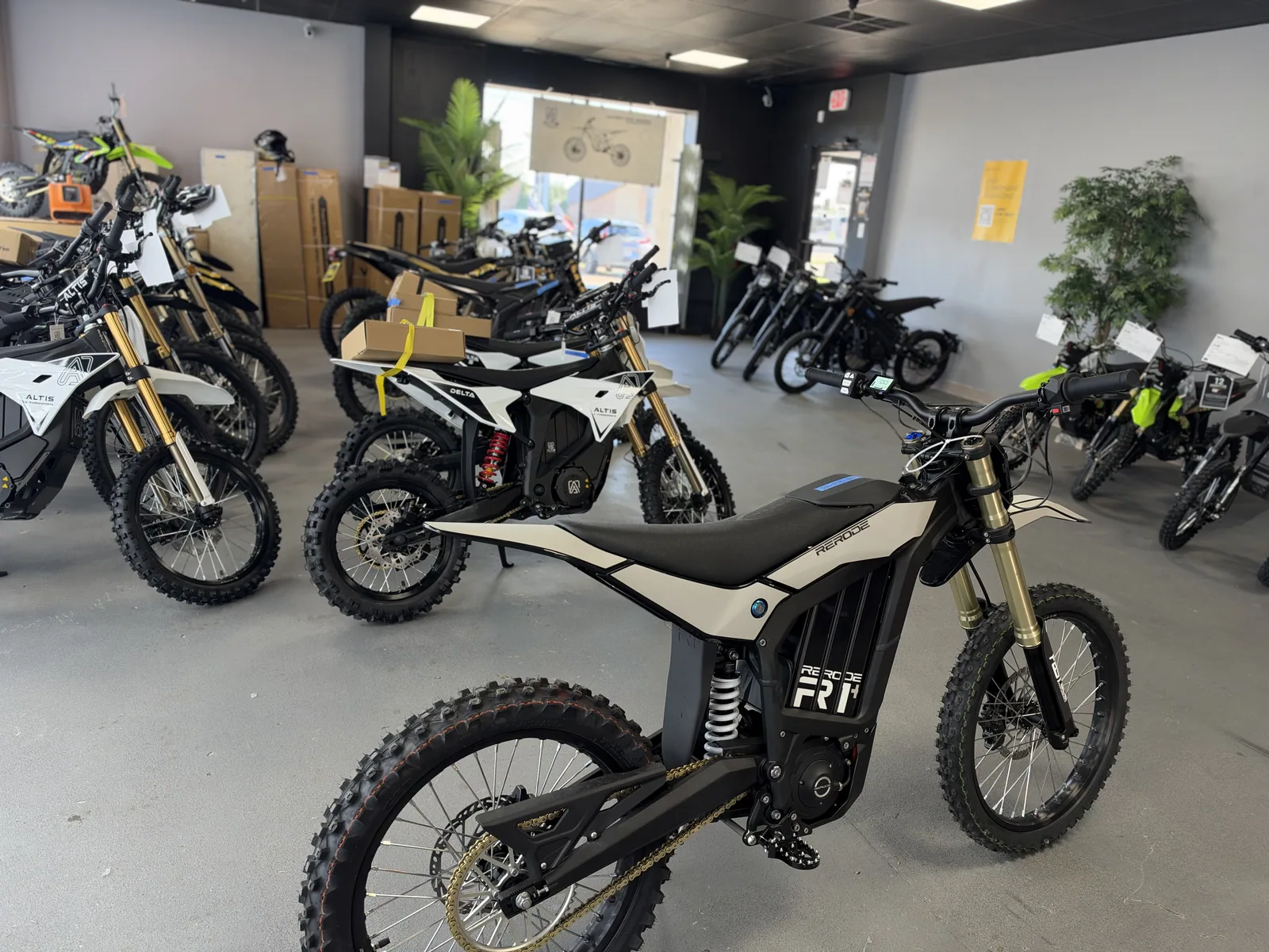 RERODE R1 Plus electric dirt bike side view on the showroom floor at VoltRush USA