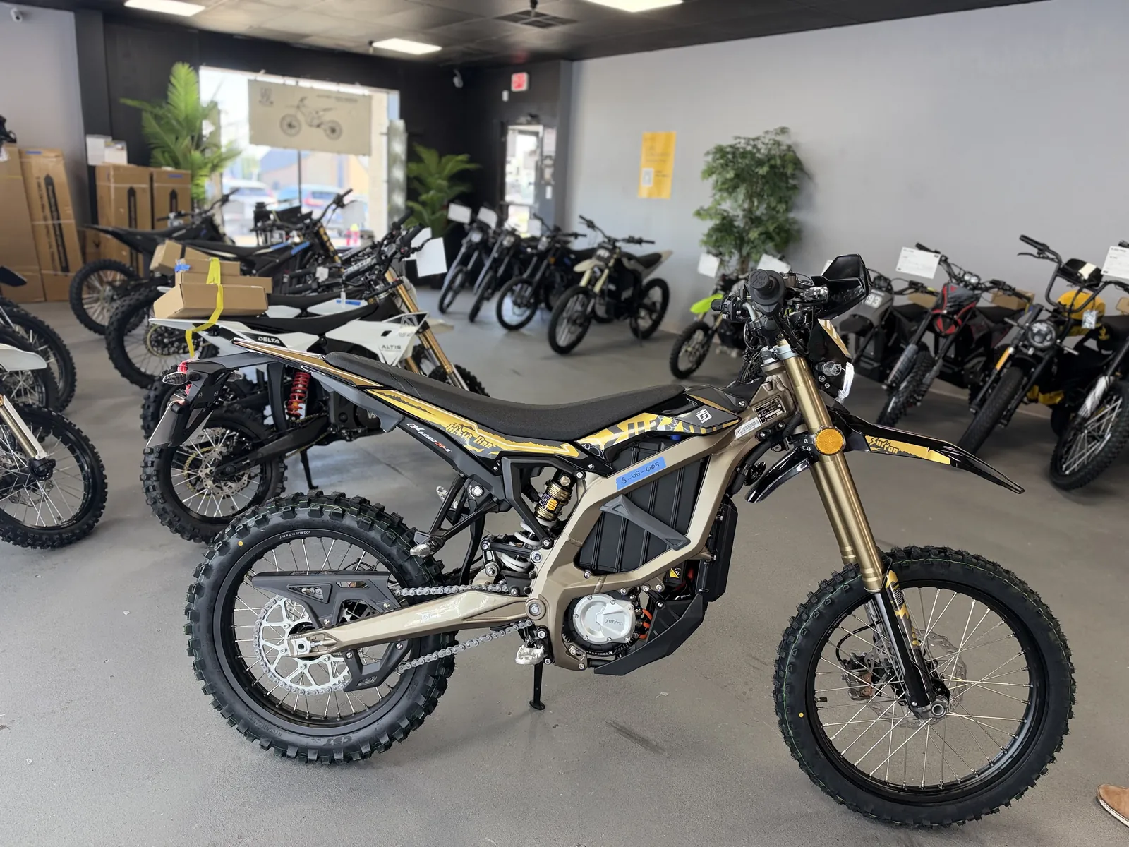 Surron Ultra Bee electric dirt bike side view at VoltRush USA