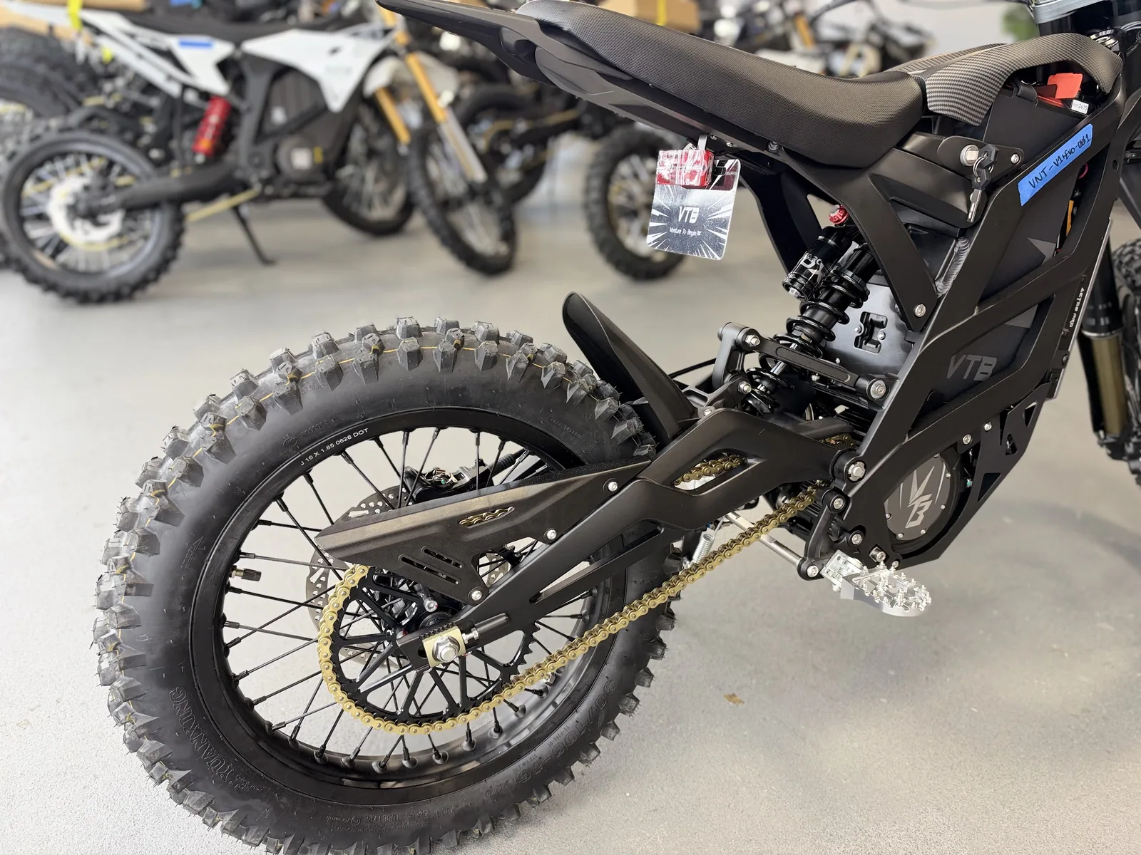 Ventus V1+ EVO electric dirt bike swingarm and rear wheel detail