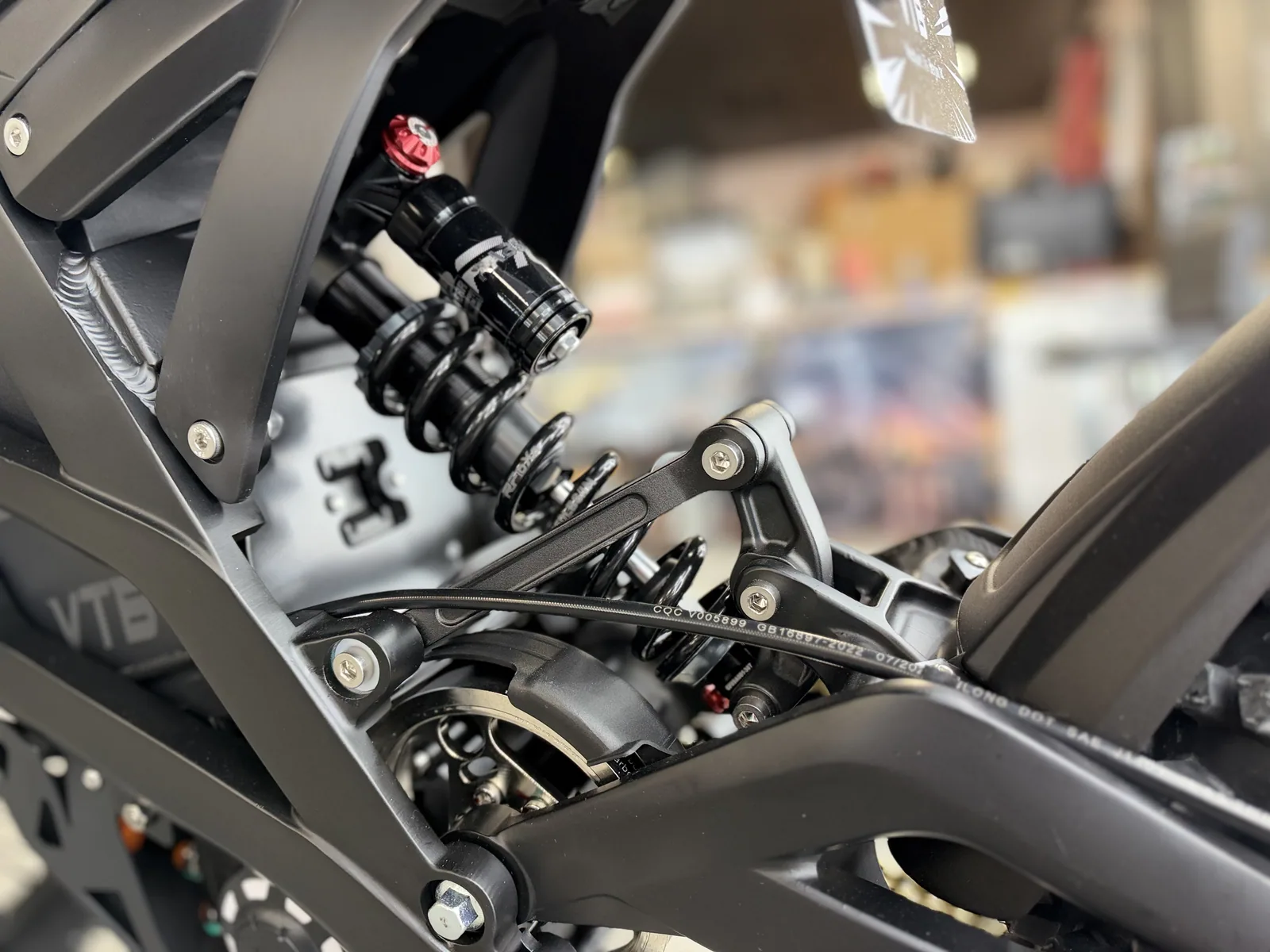 Ventus V1+ EVO electric dirt bike rear shock linkage detail