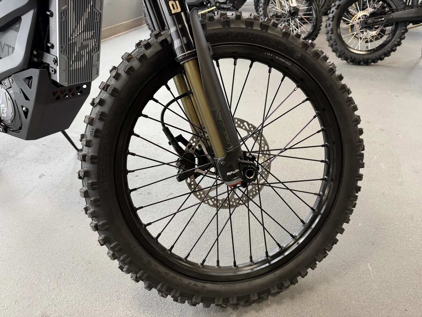 Ventus V1+ EVO electric dirt bike front wheel and fork detail