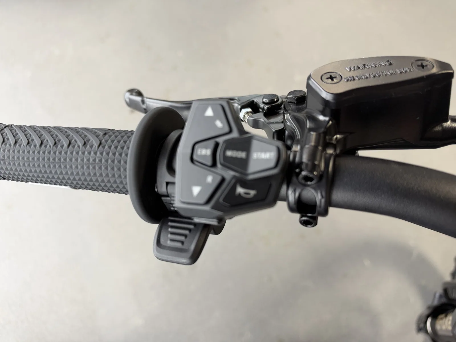 Ventus V1+ EVO electric dirt bike left handlebar controls detail
