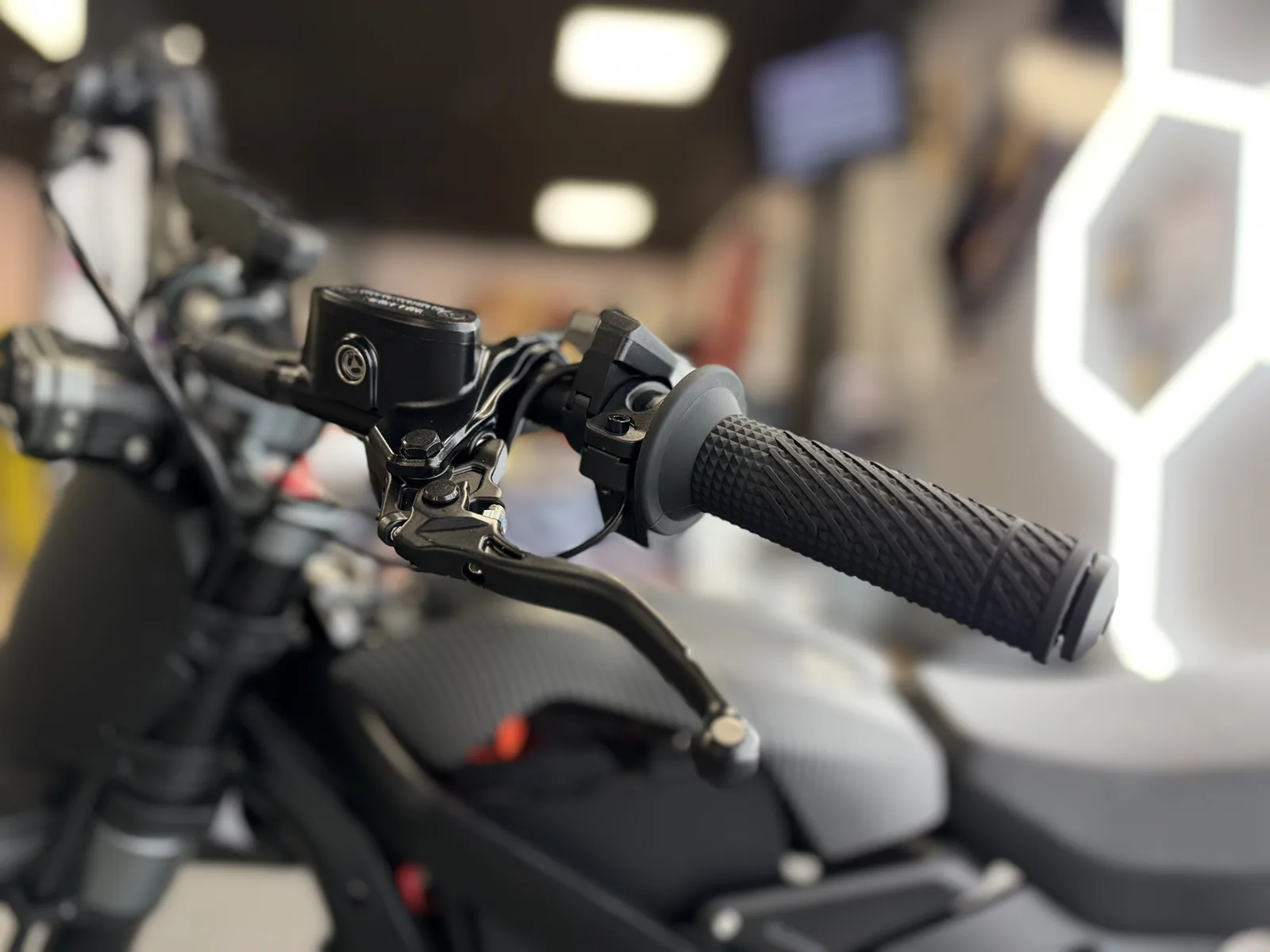 Ventus V1+ EVO electric dirt bike right grip and brake lever detail